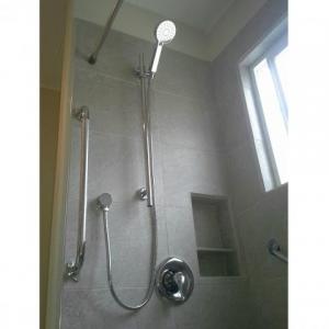 Hand held shower in a walk in shower done by The Comfort Zone Mobility Aids & Spas in Port Alberni, Vancouver Island, BC.  Call to set up an appointment for your onsite survey so that we can provide you with an accurate quote 250 724 4477 or email info@albernicomfortzone.com