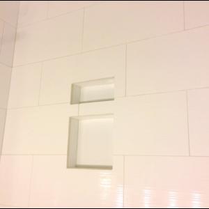 Textured White tile in a walk in shower done by The Comfort Zone Mobility Aids & Spas in Port Alberni, Vancouver Island, BC.  Call to set up an appointment for your onsite survey so that we can provide you with an accurate quote 250 724 4477 or email info@albernicomfortzone.com
