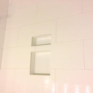 Textured White tile in a walk in shower done by The Comfort Zone Mobility Aids & Spas in Port Alberni, Vancouver Island, BC.  Call to set up an appointment for your onsite survey so that we can provide you with an accurate quote 250 724 4477 or email info@albernicomfortzone.com